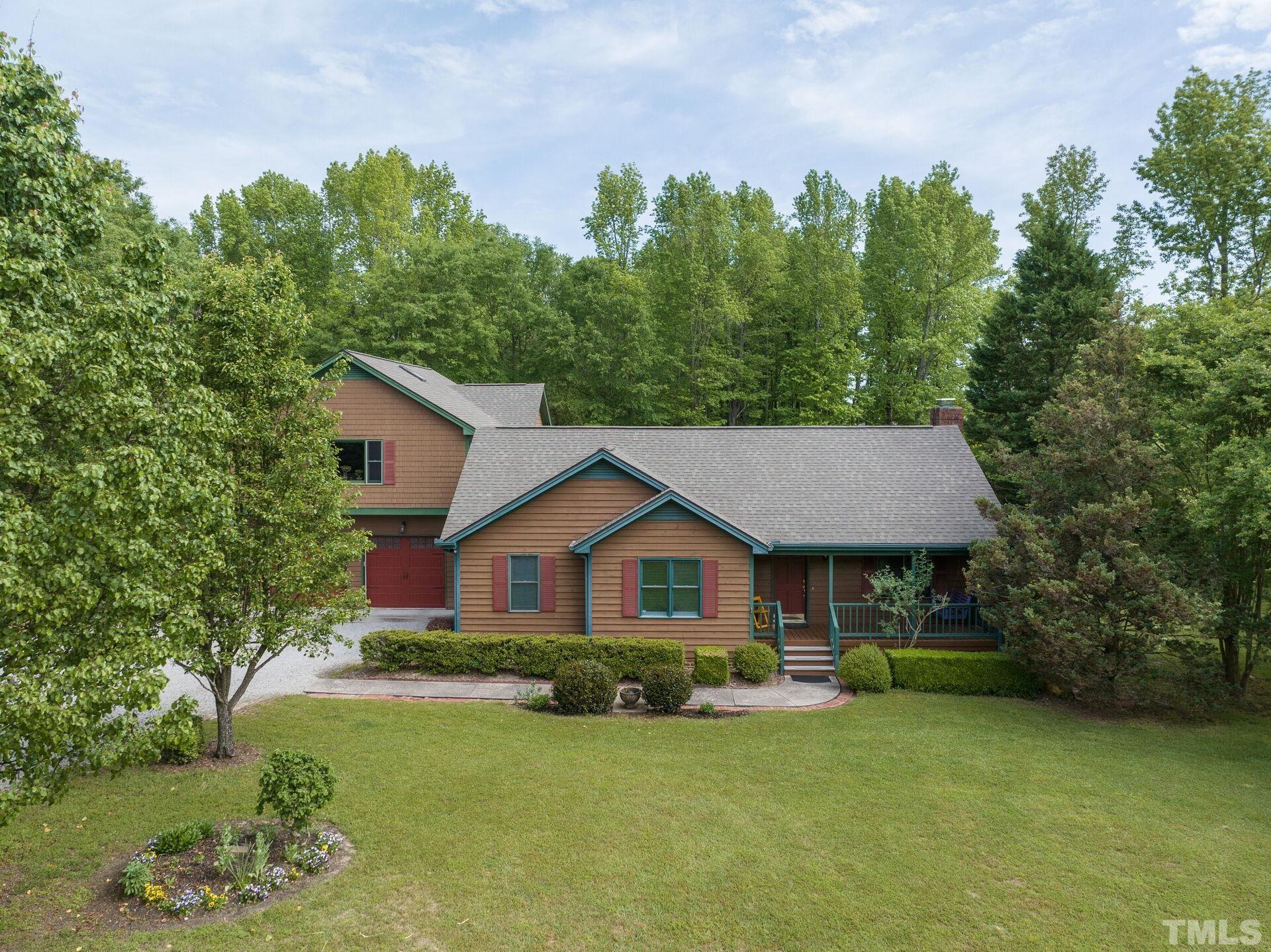 920 Wagstaff Road Fuquay-Varina, NC 27526 - Photo 43 of 58 a front view of a house with garden