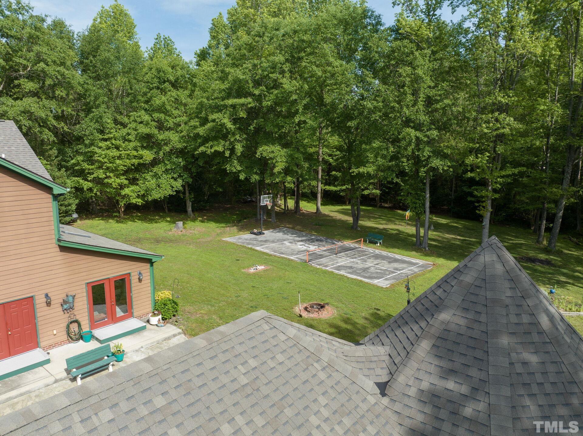 920 Wagstaff Road Fuquay-Varina, NC 27526 - Photo 49 of 58 a view of a backyard with a tree