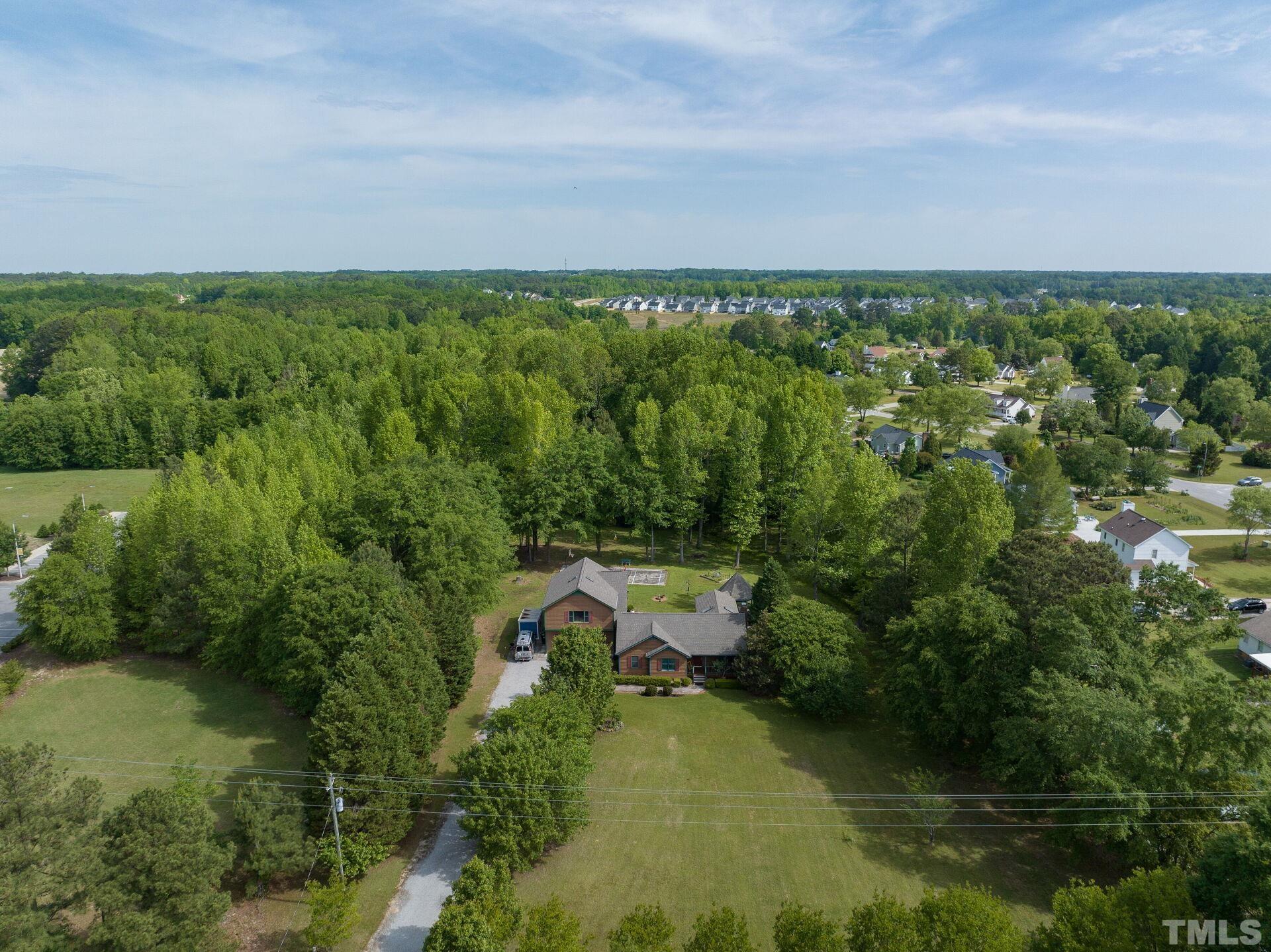 920 Wagstaff Road Fuquay-Varina, NC 27526 - Photo 54 of 58 an aerial view of a house with a yard