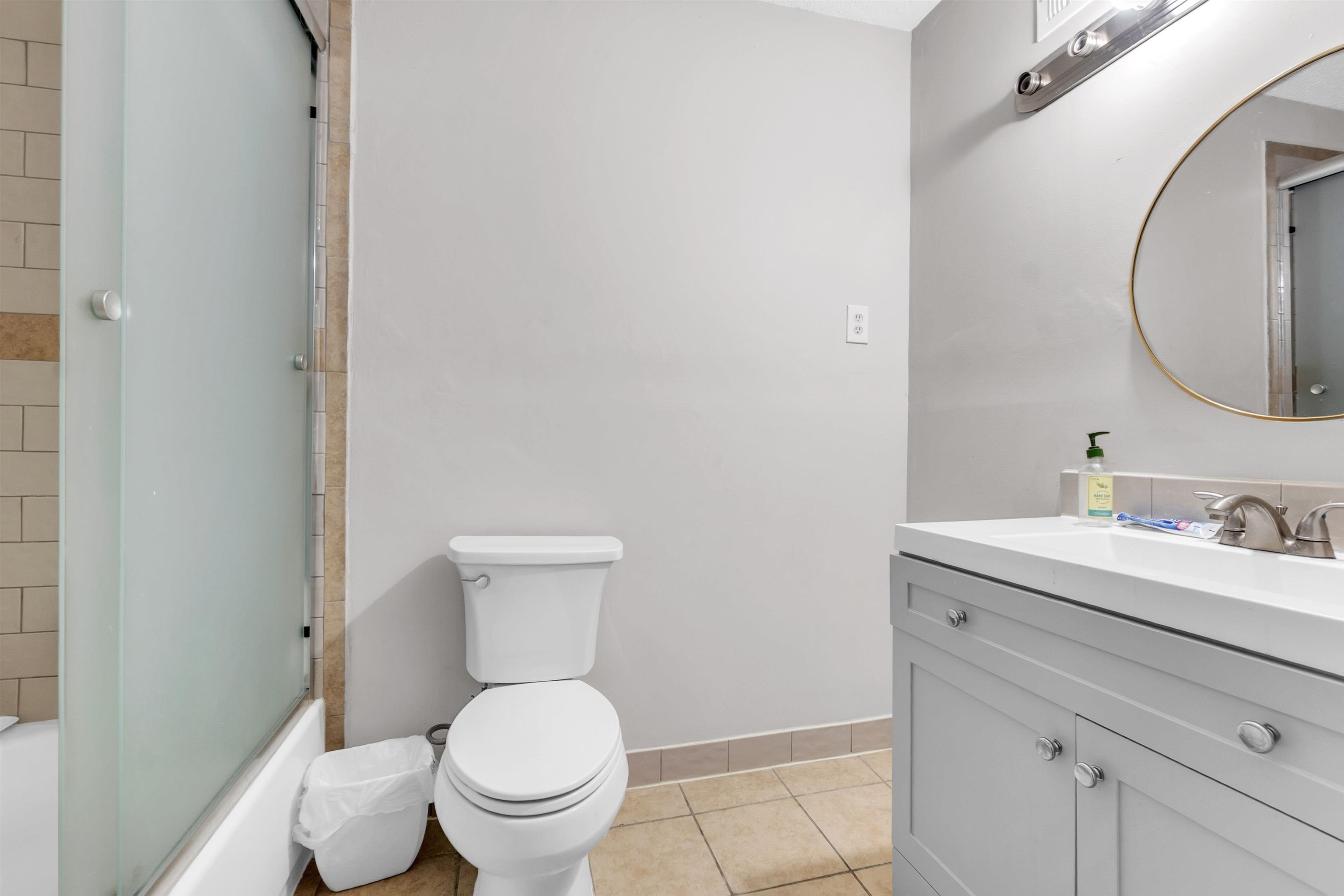 3463 Dupre Street Memphis, TN 38115 - Photo 22 of 25 Full bathroom with vanity, shower / bath combination with glass door, and light tile patterned floors