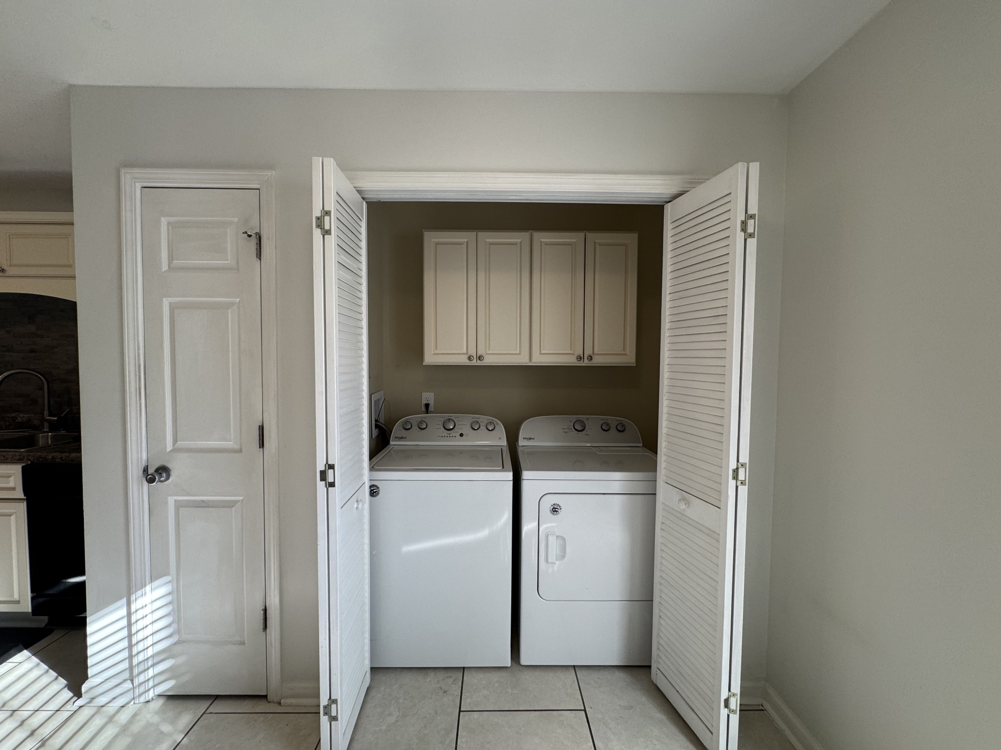 531 Dill Lane, Unit A9 Murfreesboro, TN 37130 - Photo 14 of 24 a utility room with cabinets washer and dryer