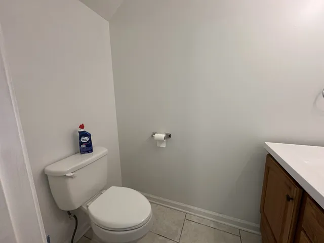 a bathroom with a sink vanity and a mirror