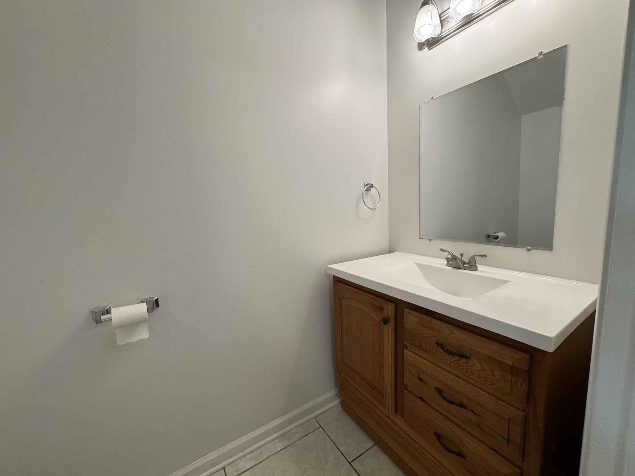 531 Dill Lane, Unit A9 Murfreesboro, TN 37130 - Photo 16 of 24 a bathroom with a sink vanity and a mirror