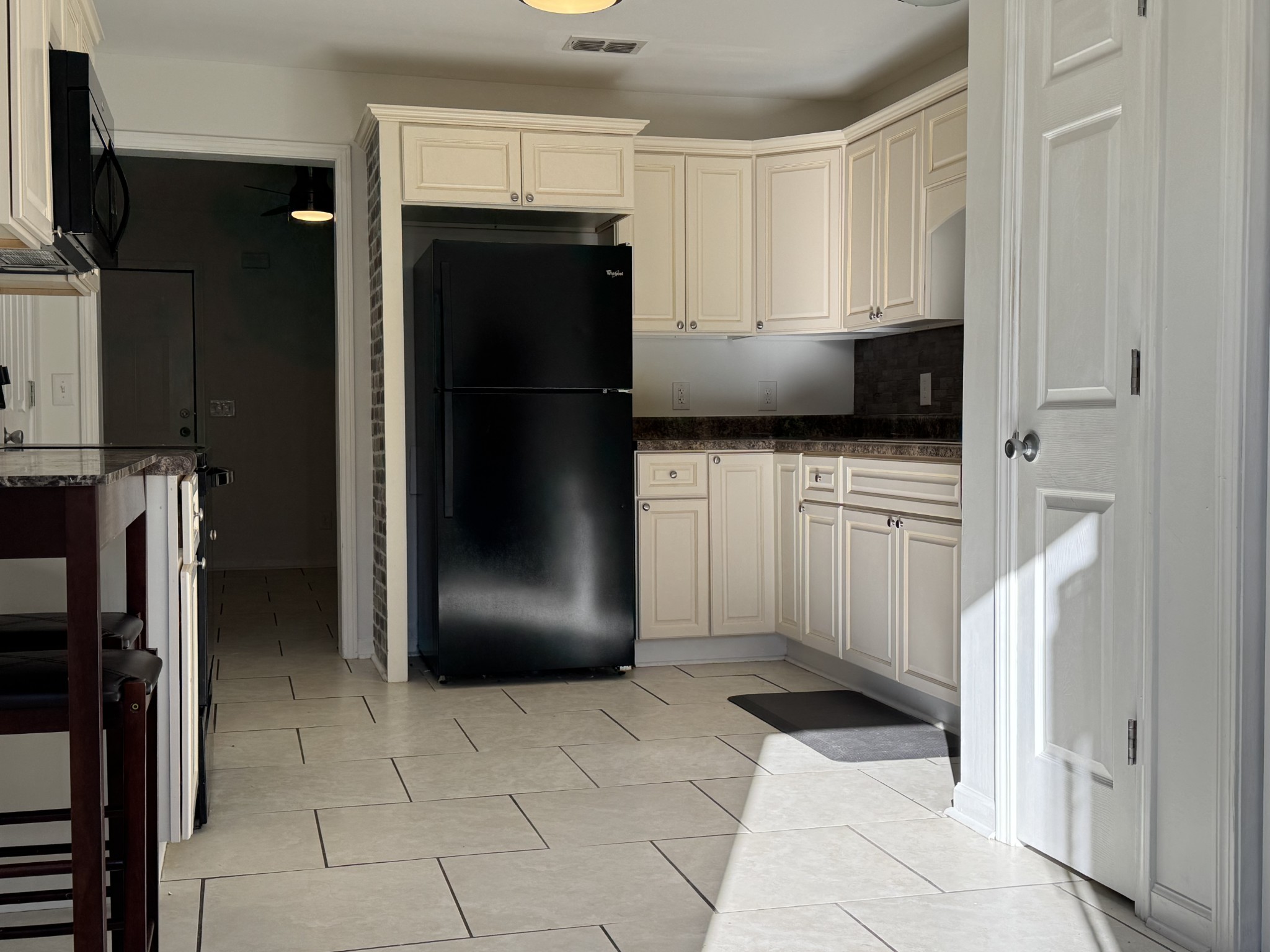 531 Dill Lane, Unit A9 Murfreesboro, TN 37130 - Photo 20 of 24 a kitchen with a refrigerator a stove and cabinets