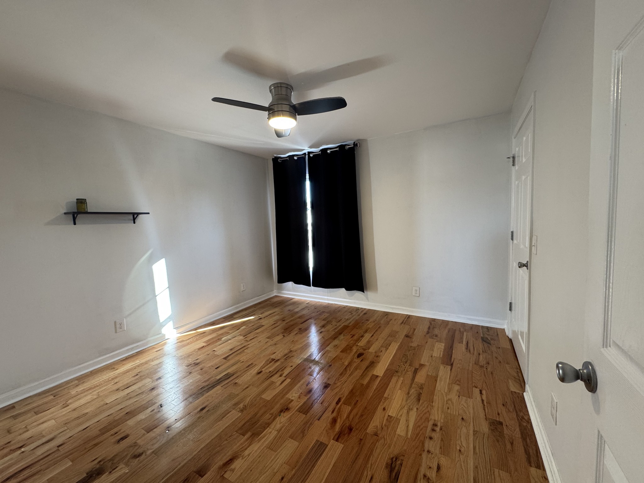 531 Dill Lane, Unit A9 Murfreesboro, TN 37130 - Photo 22 of 24 wooden floor in an empty room with a window