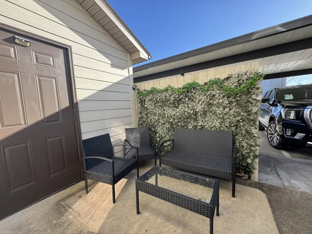 a building outdoor space with patio furniture