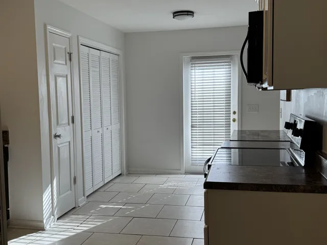 a view of a kitchen with a sink and a microwave