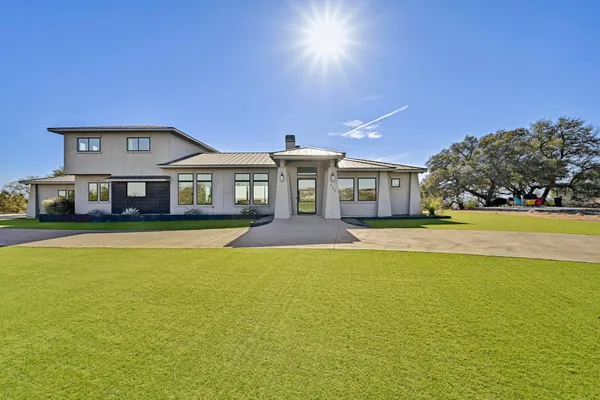 a front view of a house with swimming pool