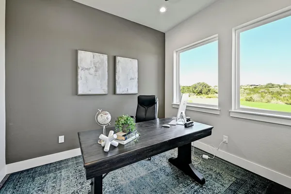 a workspace with furniture and window