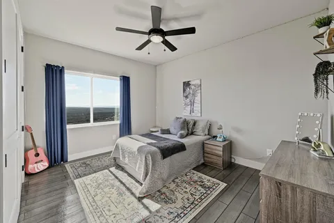 a living room with a bed furniture and a window