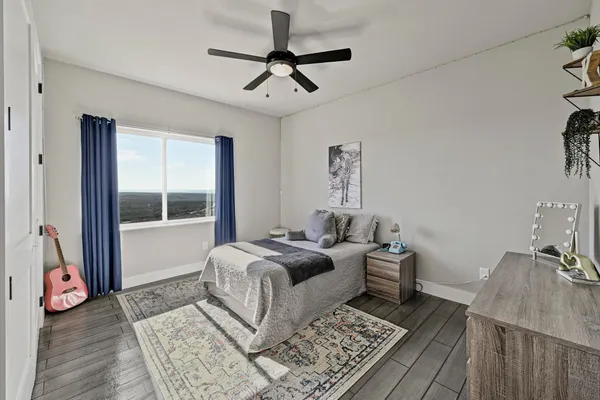 a living room with a bed furniture and a window
