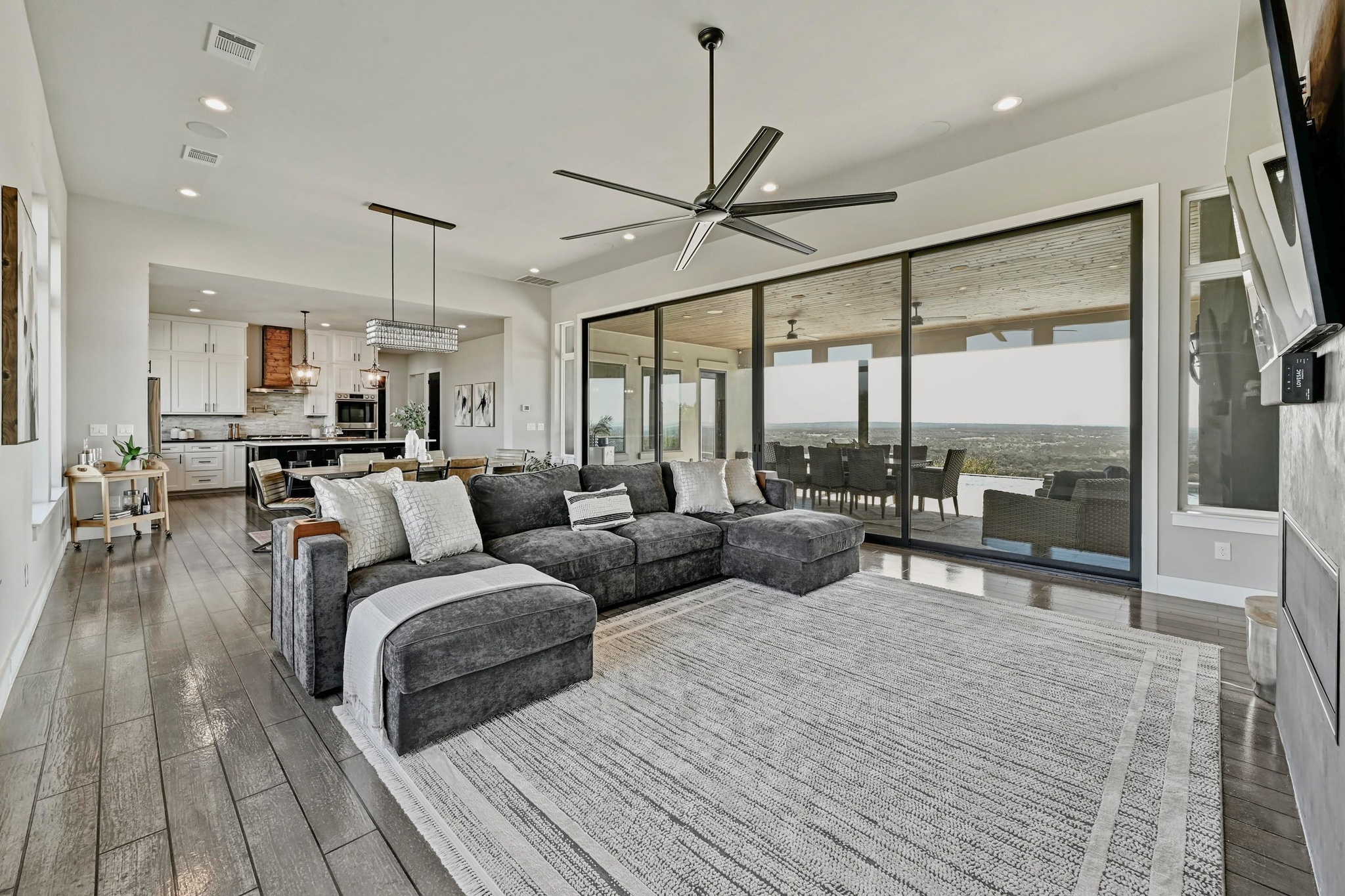 220 Eagle Ridge Burnet, TX 78611 - Photo 4 of 40 The spacious living room features soaring ceilings and expansive windows that frame stunning lake views.