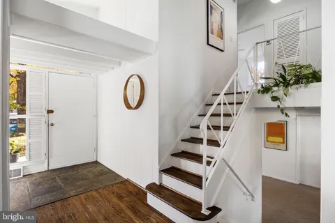 a view of entryway with wooden floor