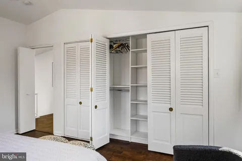 a view of a bedroom with a hardwood