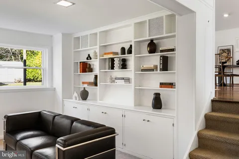 a room with furniture cabinets and white walls