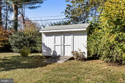 a view of a house with a tree
