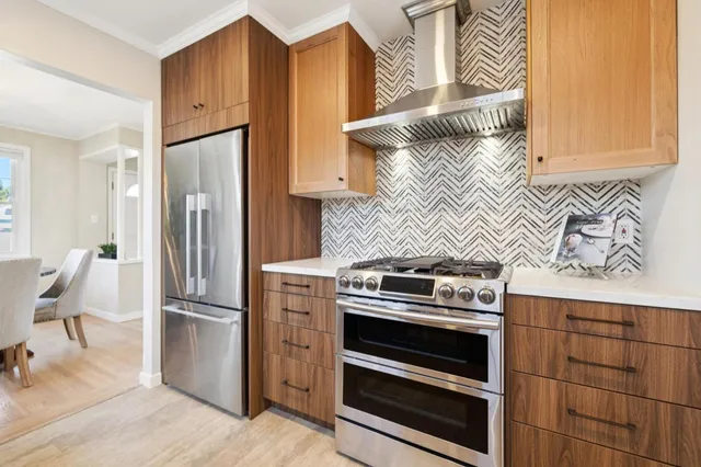 a kitchen with appliances and cabinets