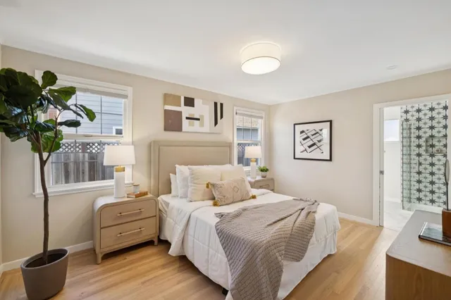 a bedroom with a bed and a couch