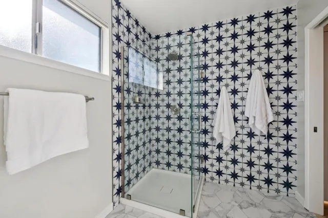 a bathroom with a toilet and a shower curtain