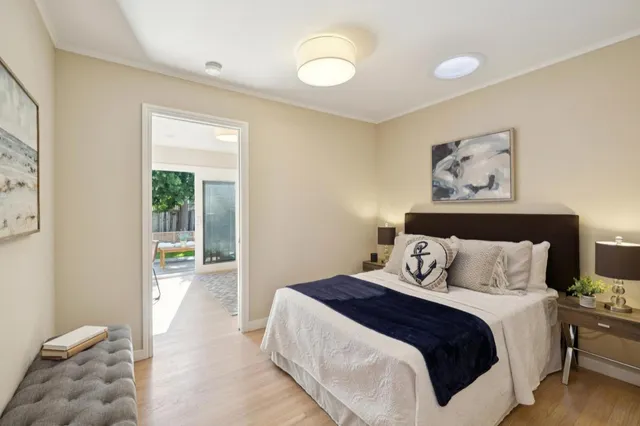 a bedroom with a large bed and a window