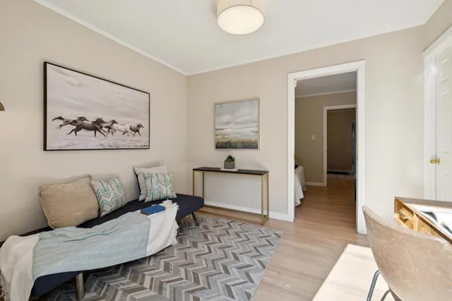 a living room with furniture and a table