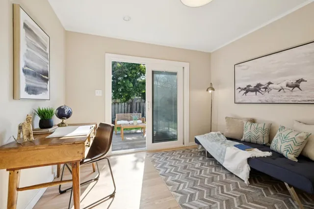 a workspace with furniture and a rug