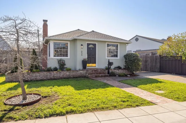 a view of a house with swimming pool and sitting area