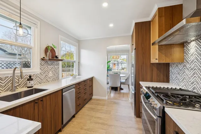 a kitchen with a sink stove and cabinets