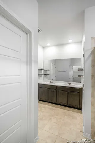 a large white kitchen with a sink