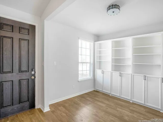 a view of an empty room with a window