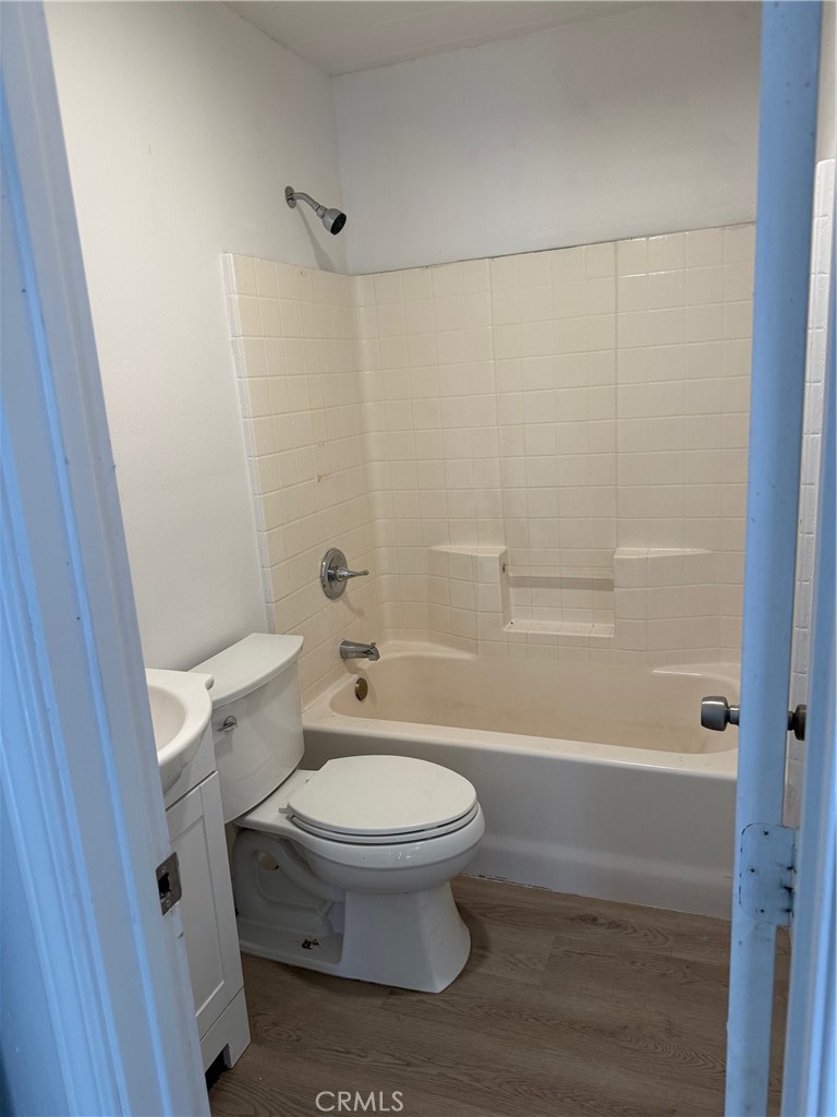 16100 Navajo Road Apple Valley, CA 92307 - Photo 41 of 55 a white toilet sitting next to a bath tub