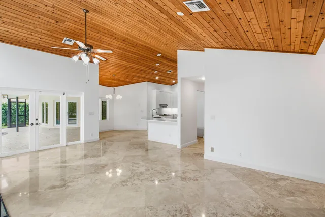 a view of a room with a ceiling fan