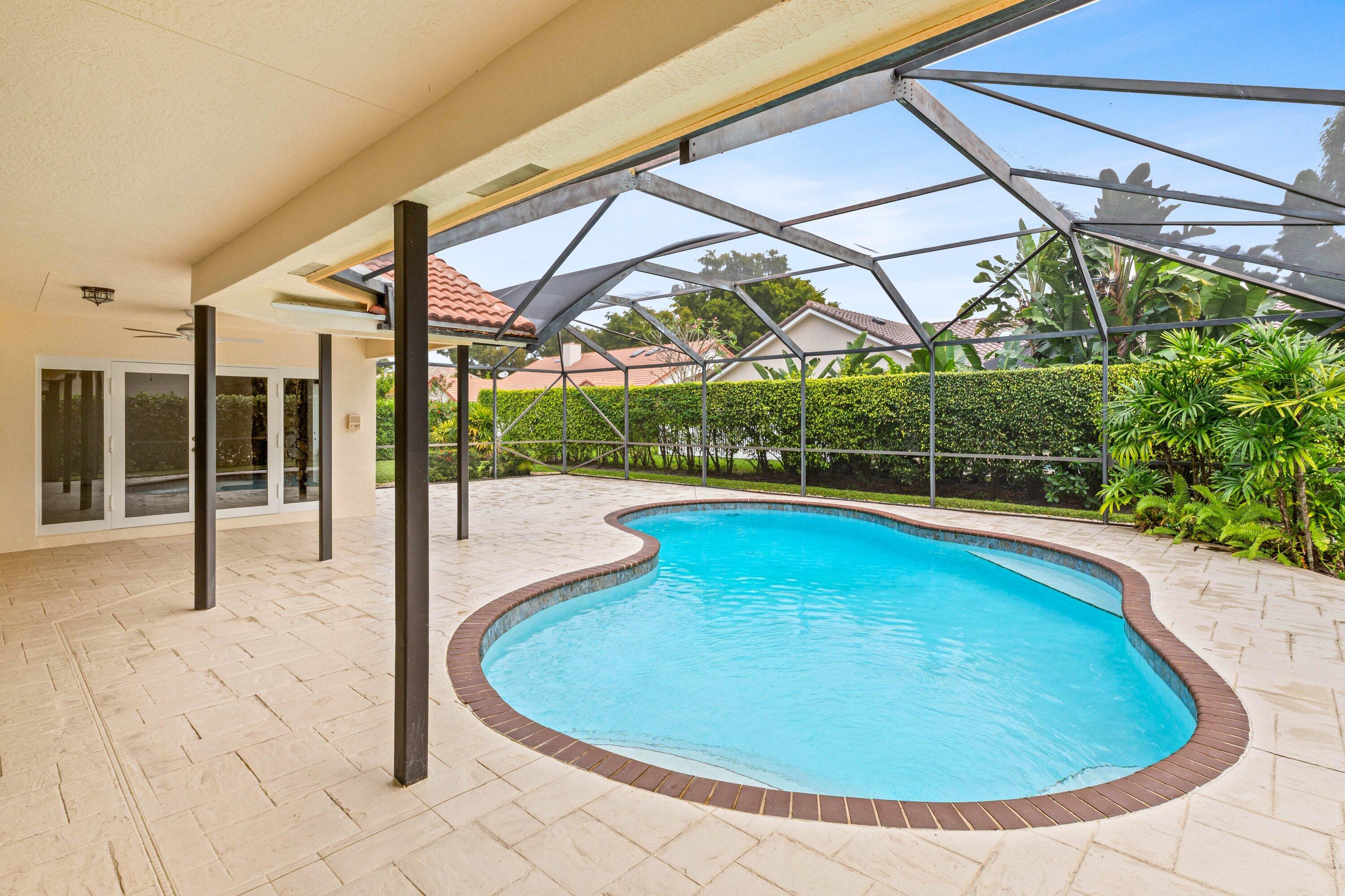 4720 Northwest 28th Avenue Boca Raton, FL 33434 - Photo 25 of 47 a view of a swimming pool with a porch