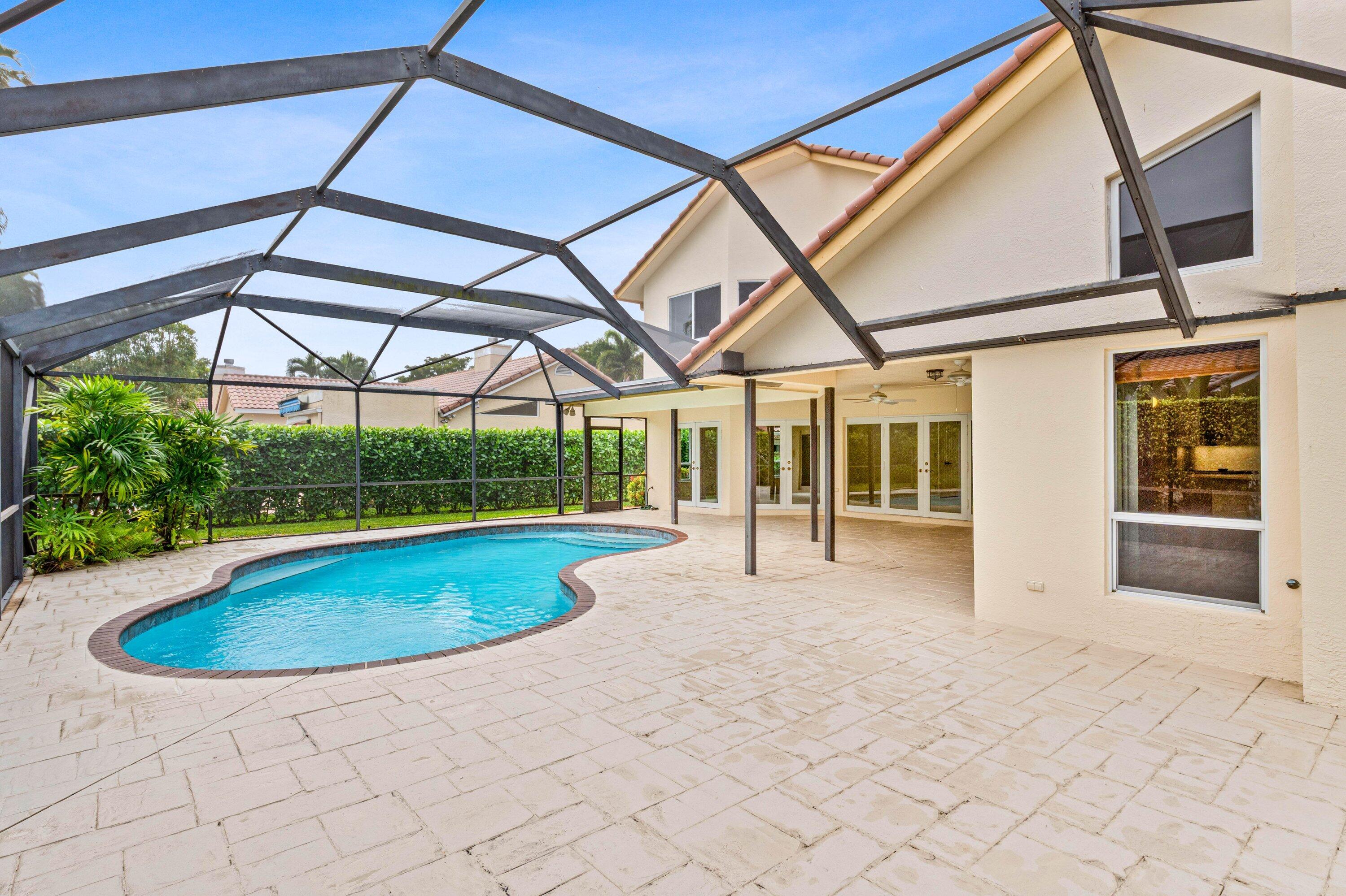 4720 Northwest 28th Avenue Boca Raton, FL 33434 - Photo 26 of 47 a view of indoor pool and garden