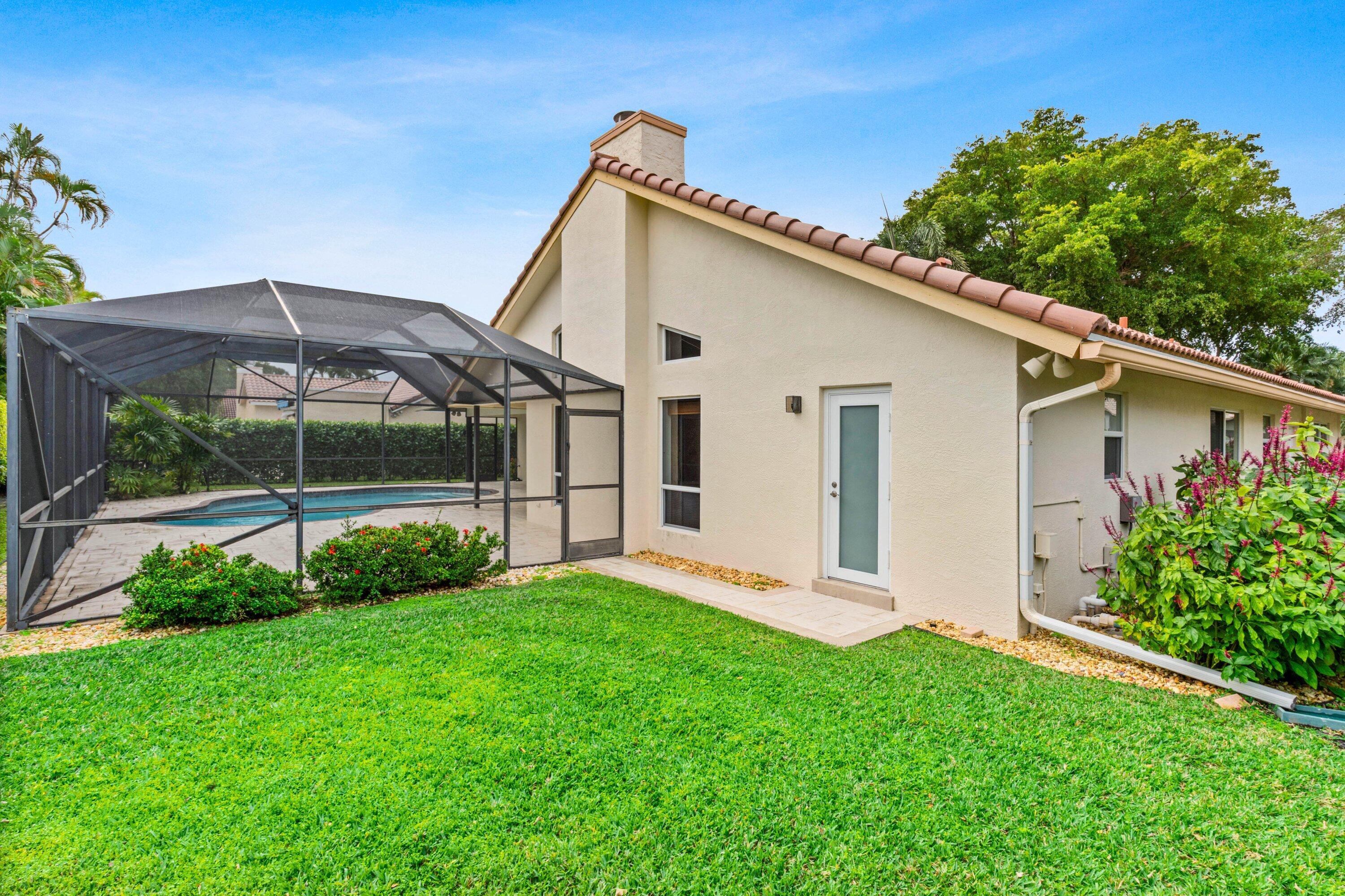 4720 Northwest 28th Avenue Boca Raton, FL 33434 - Photo 34 of 47 a view of a house with backyard and garden