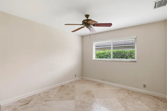 a utility room with cabinets washer and dryer
