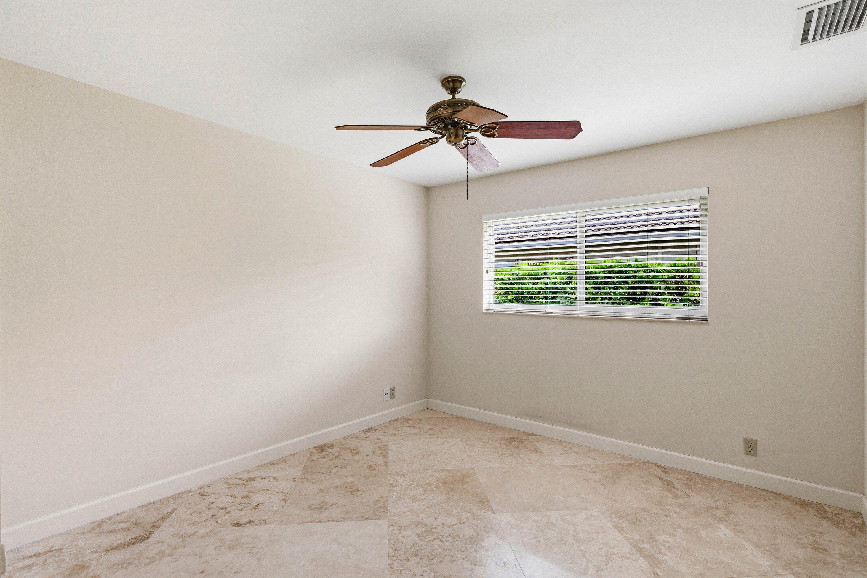 4720 Northwest 28th Avenue Boca Raton, FL 33434 - Photo 45 of 47 an empty room with a window