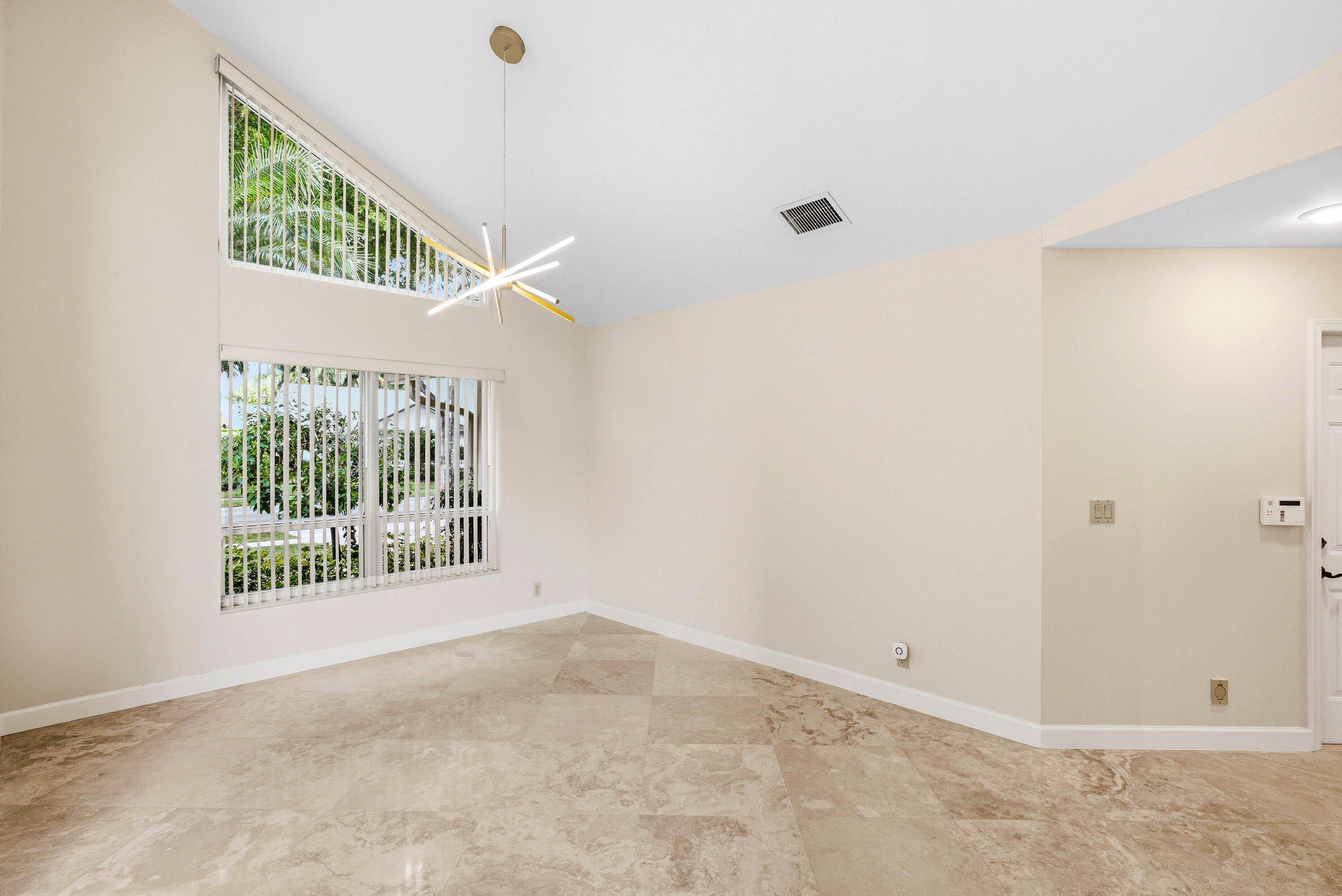 4720 Northwest 28th Avenue Boca Raton, FL 33434 - Photo 8 of 47 a view of an empty room with a window