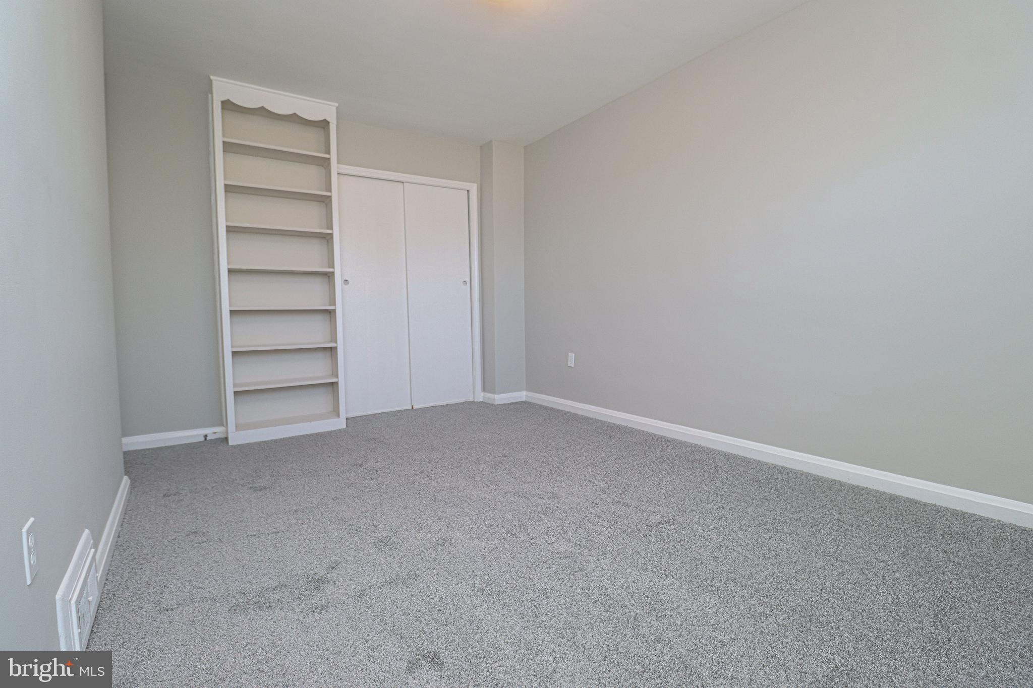 1260 Cedarcroft Road Baltimore, MD 21239 - Photo 21 of 30 a view of an empty room and a window