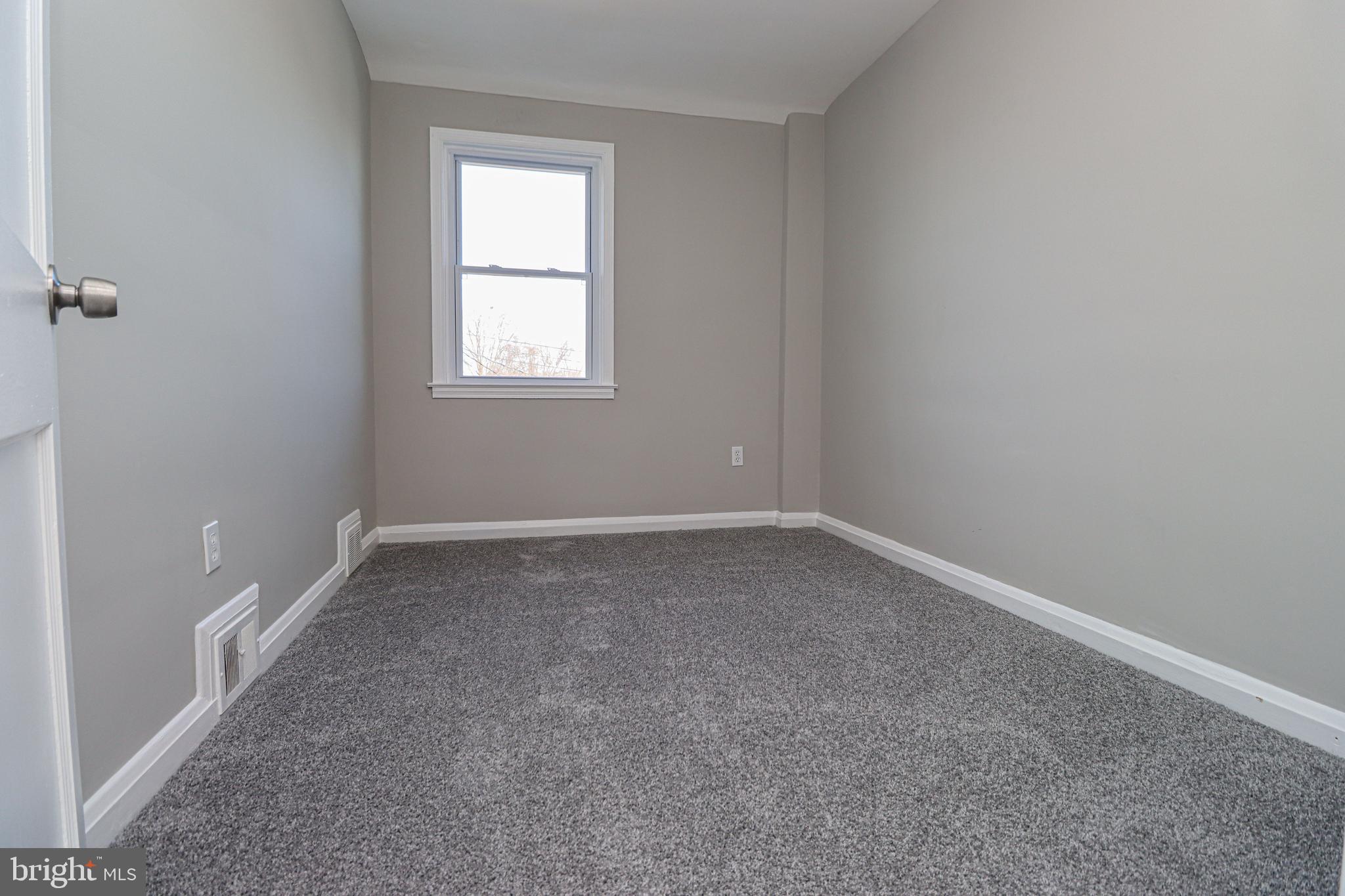 1260 Cedarcroft Road Baltimore, MD 21239 - Photo 23 of 30 an empty room with a window