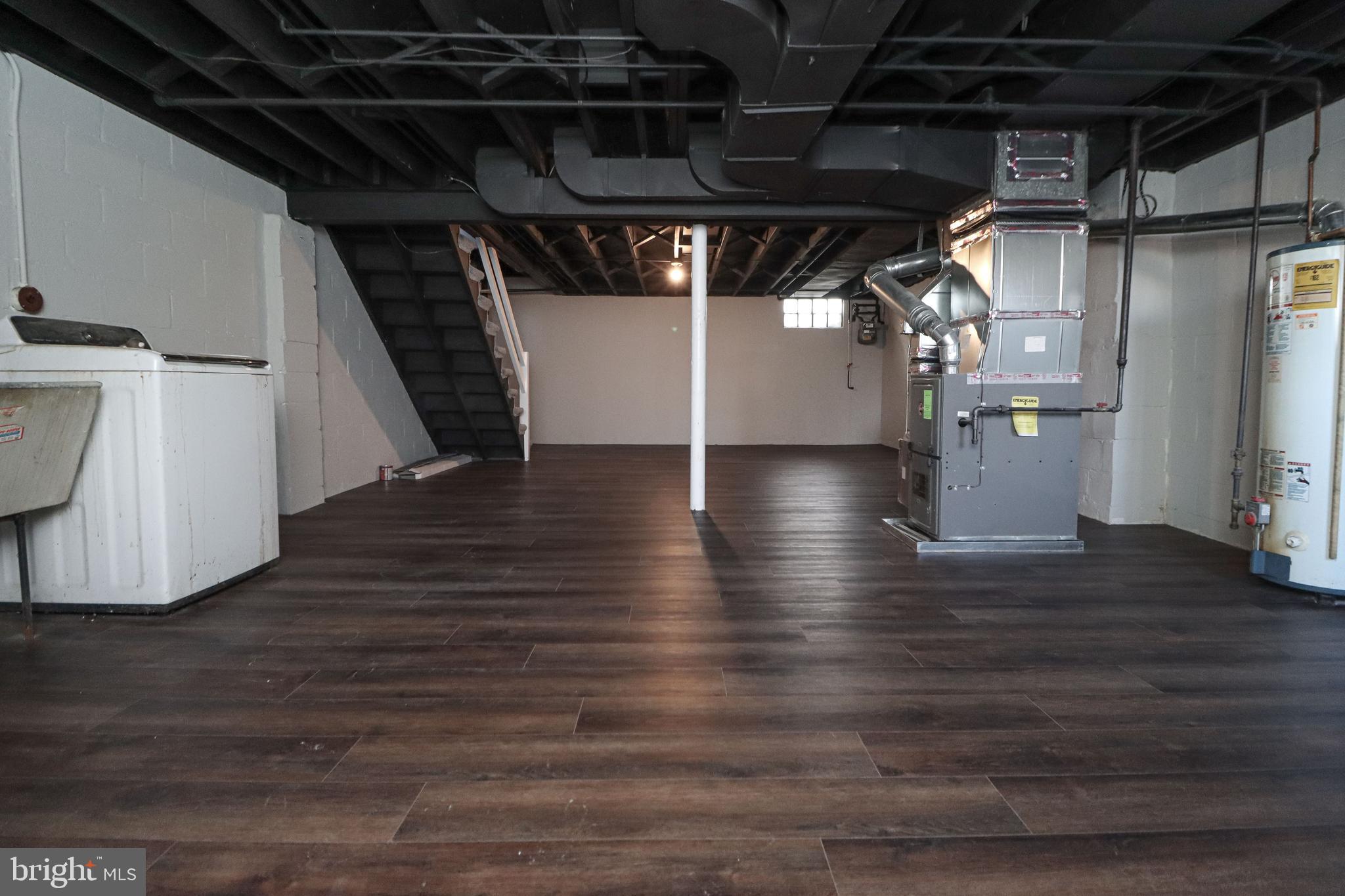 1260 Cedarcroft Road Baltimore, MD 21239 - Photo 28 of 30 a view of water heater room with wooden floor