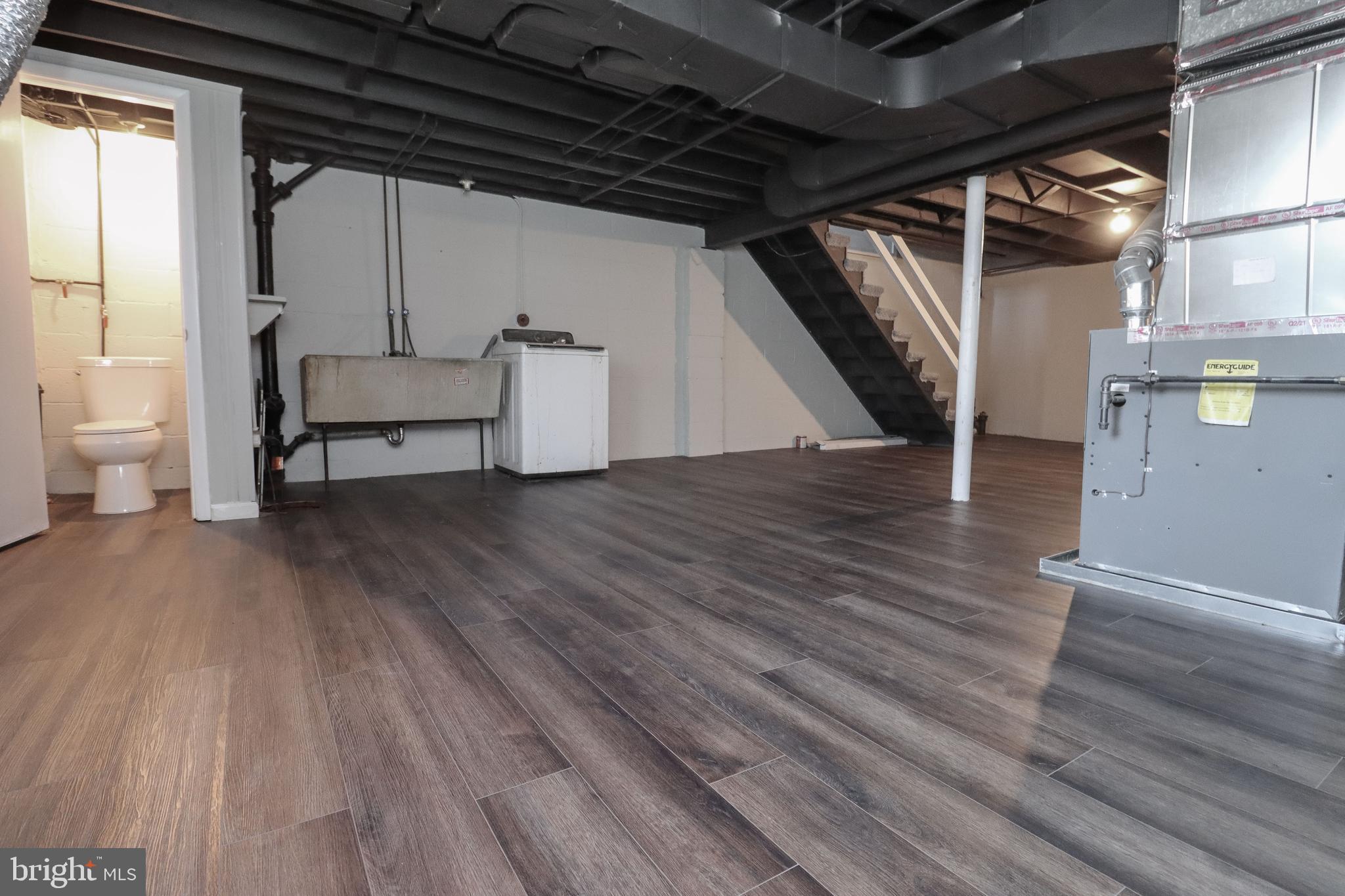 1260 Cedarcroft Road Baltimore, MD 21239 - Photo 29 of 30 a view of a livingroom with wooden floor and furniture
