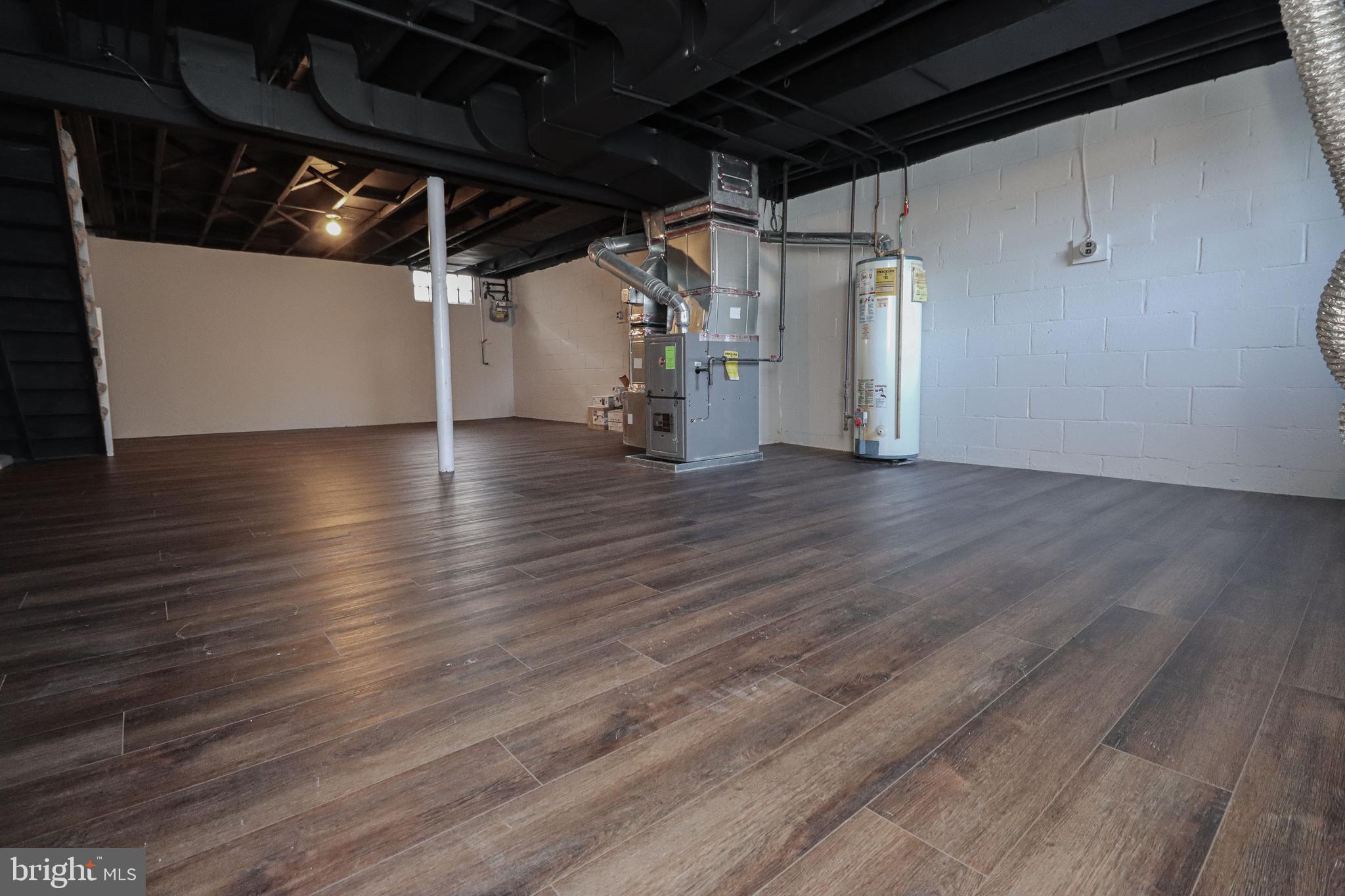 1260 Cedarcroft Road Baltimore, MD 21239 - Photo 30 of 30 a view of empty room with wooden floor
