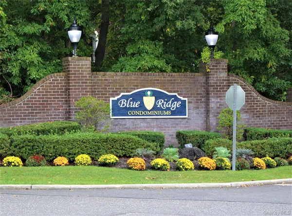 a sign that is in front of flowers