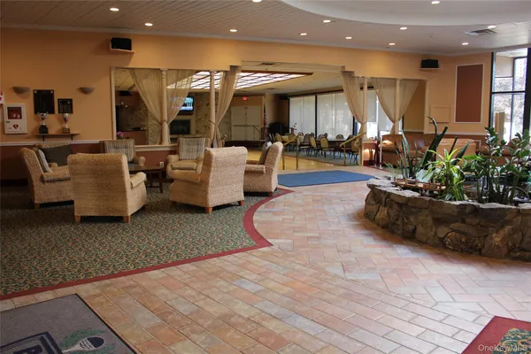 an outdoor space with furniture and garden