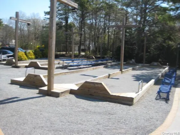a room with pool table and windows