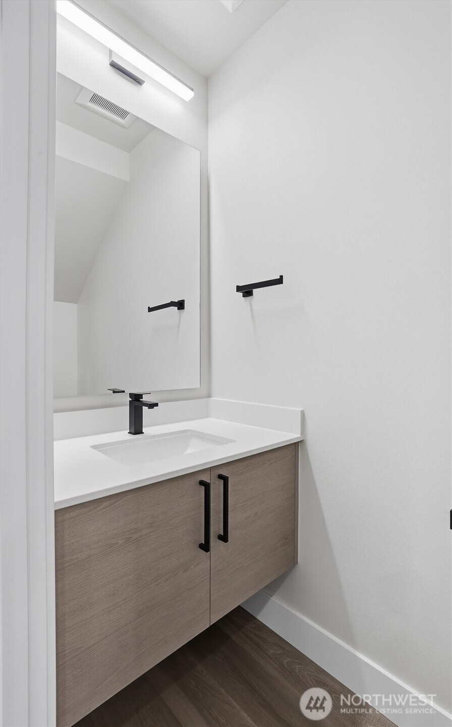 3324 35th Avenue South, Unit A Seattle, WA 98144 - Photo 11 of 20 a bathroom with a sink and mirror