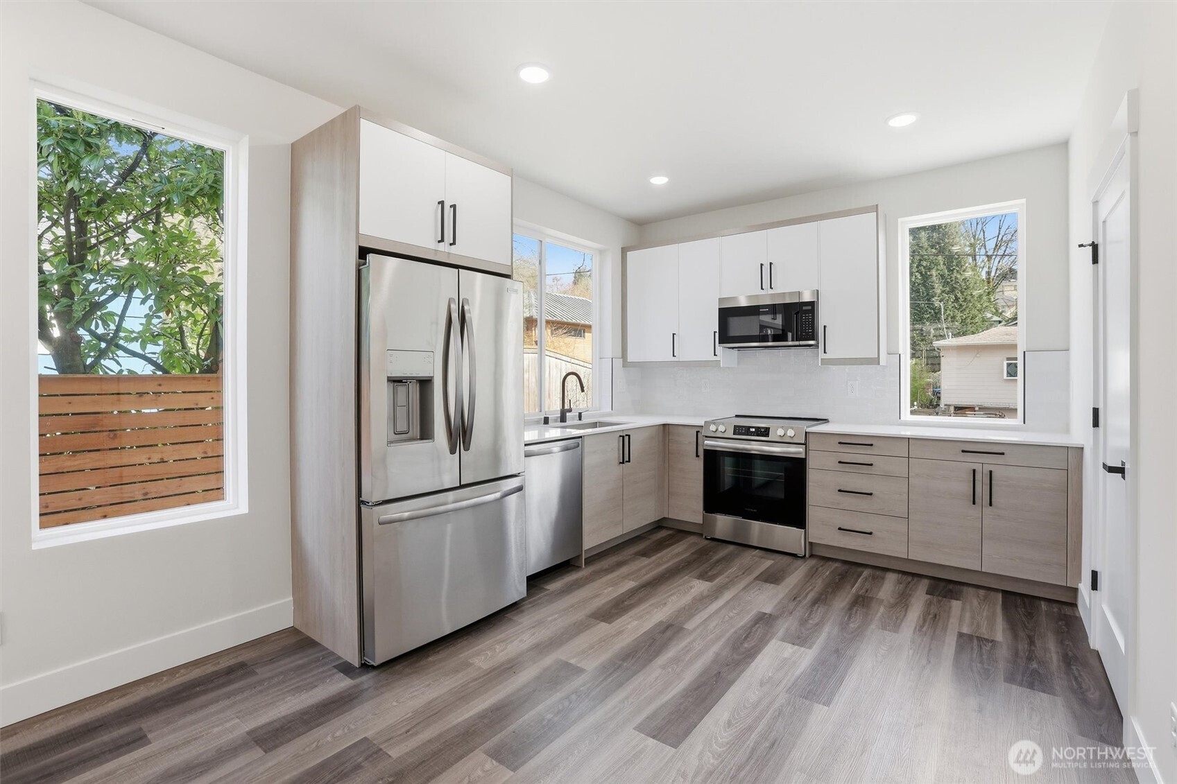 3324 35th Avenue South, Unit A Seattle, WA 98144 - Photo 7 of 20 a kitchen with a refrigerator stove and sink