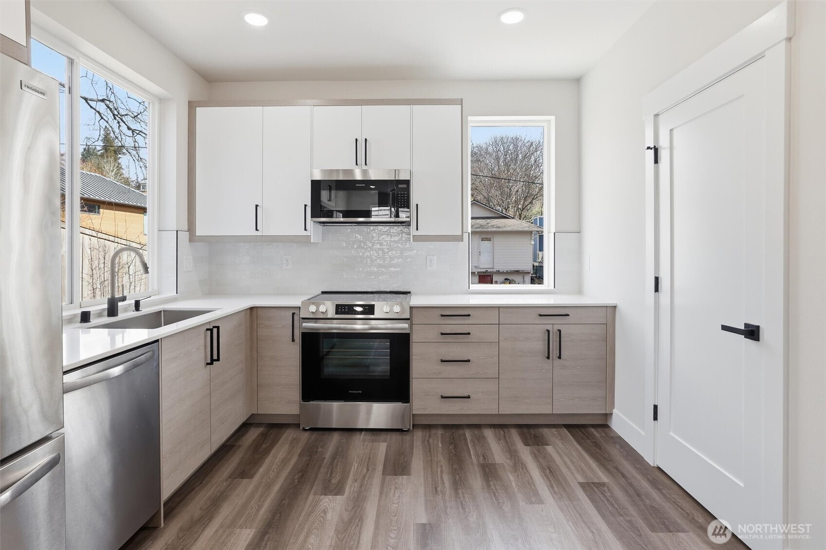 3324 35th Avenue South, Unit A Seattle, WA 98144 - Photo 8 of 20 a kitchen with stainless steel appliances a stove sink and refrigerator