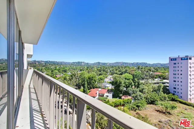 a view of a backyard patio and swimming pool